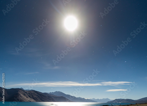 Beautiful scenery and view full moon glowing over Pangong Lake in Ladakh, India