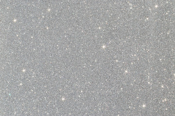 glitter vintage lights background. silver de-focused.
