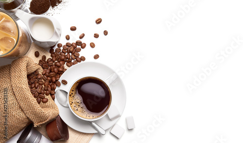 Leinwand Poster Cup of hot coffee and other ingredients over white background