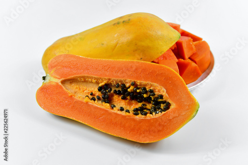 Slice of papaya on white background