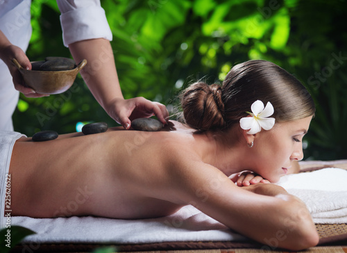 portrait of young beautiful woman in spa environment. 