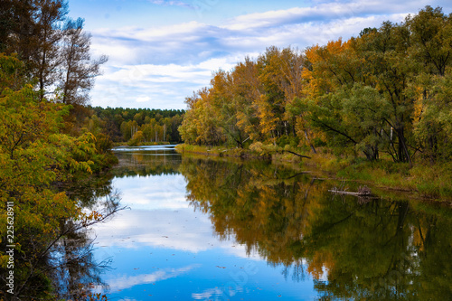 Fototapeta Naklejka Na Ścianę i Meble -  Autumn river and blue sky.