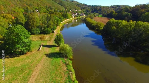 Camera flight over The Berounka river near Zbecno. Beautiful natural park in Czech Republic. European landmarks from above. photo