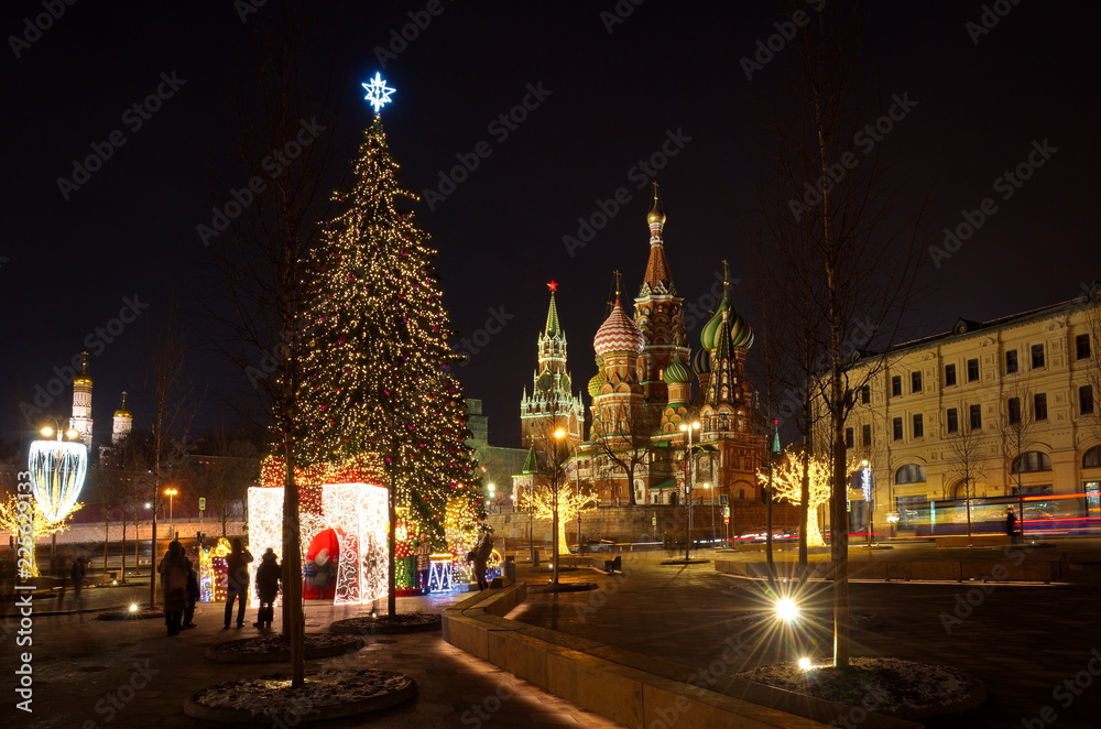 Moscow, Russia - January 10, 2018: Christmas tree in the square near Zaryadye landscape Park on a winter evening. Varvarka street