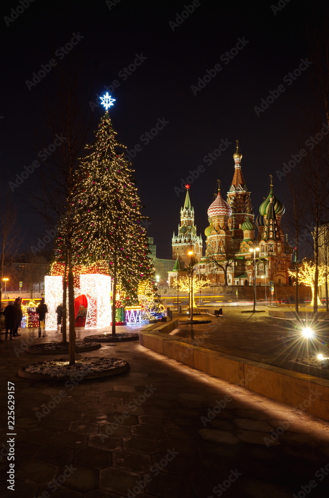 Moscow, Russia - January 10, 2018: Christmas tree in the square near Zaryadye Park on a winter evening. Varvarka street