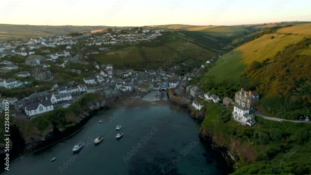 Drone flies slowly over harbor towards village of Port Isaac Cornwall Drone flies slowly over harbor towards village of Port Isaac Cornwall