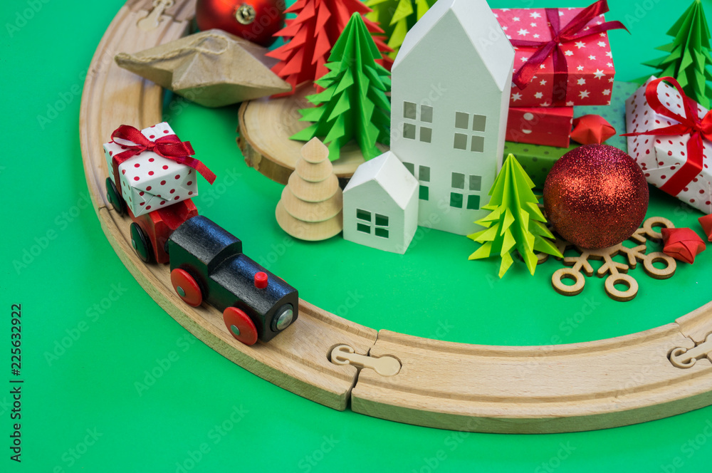 toy wooden train carries a box with gift the child