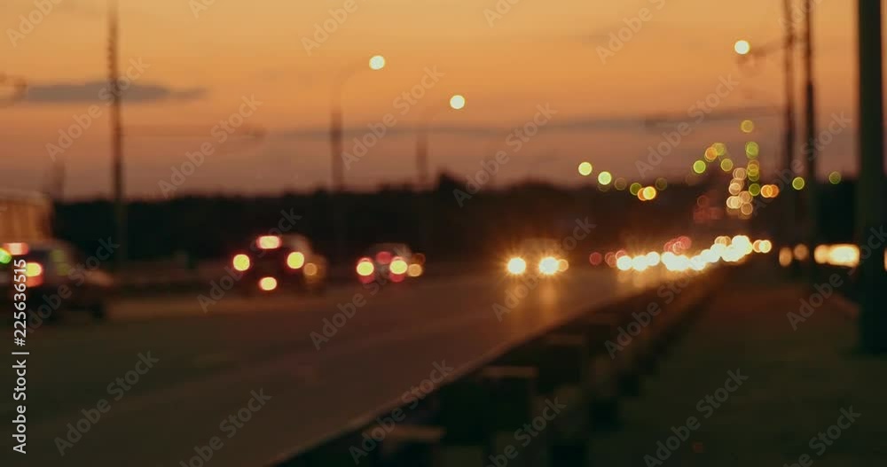 Rush hour on freeway in the night, blured lights of commuters cars Rush hour on freeway in the night, blured lights of commuters cars