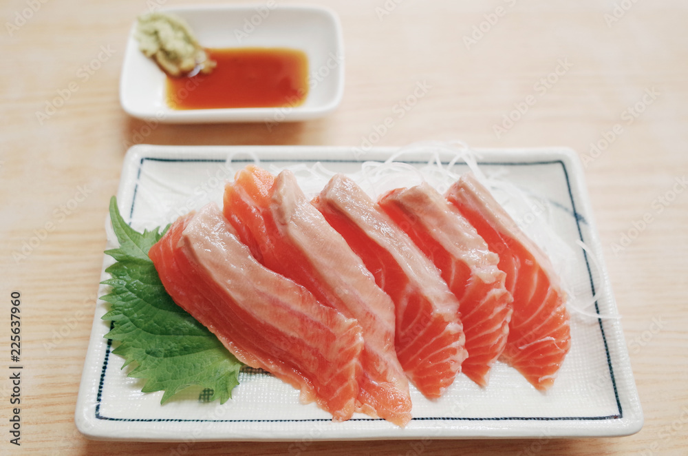 Fresh Raw Salmon Slide Serve with Wasabi and Sauce at Fish Market Fresh Raw Salmon Slide Serve with Wasabi and Sauce at Fish Market
