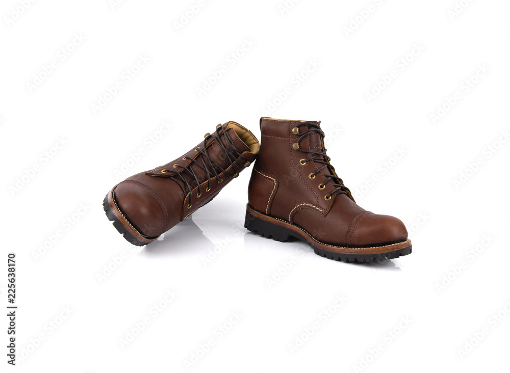 Men’s brown boots isolated on white background. Men’s brown boots isolated on white background.