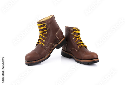 Men’s brown boots isolated on a white background.