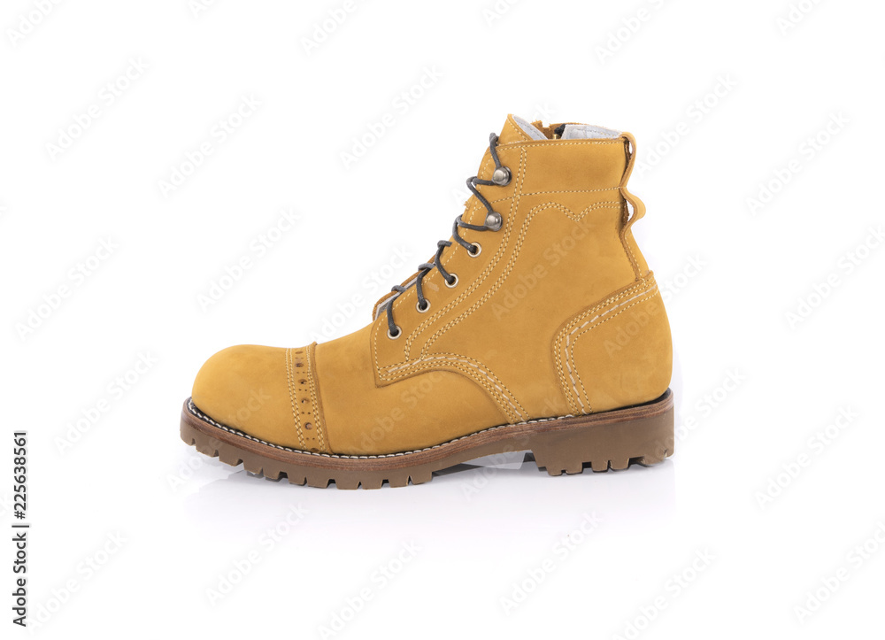 Men's yellow boot  isolated on a white background. Fashion advertising boot photos.