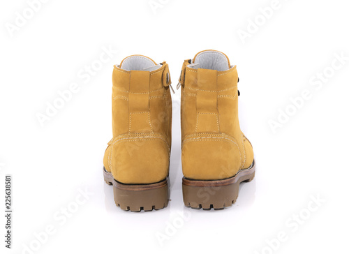 Men’s yellow boot isolated on a white background.