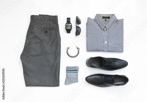 Men's casual outfits for man clothing with shirt, watch, sock, sunglasses, bracelet and black shoe isolate on white background, Top view