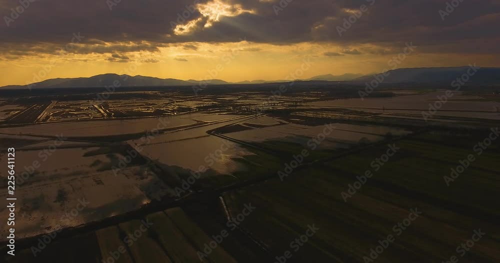 Aerial, beautiful giant swamp situated in Tuscany, Italy on sunset Aerial, beautiful giant swamp situated in Tuscany, Italy on sunset