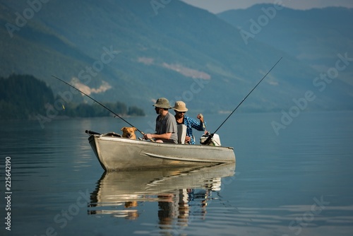 Two fishermen fishing in the river photo