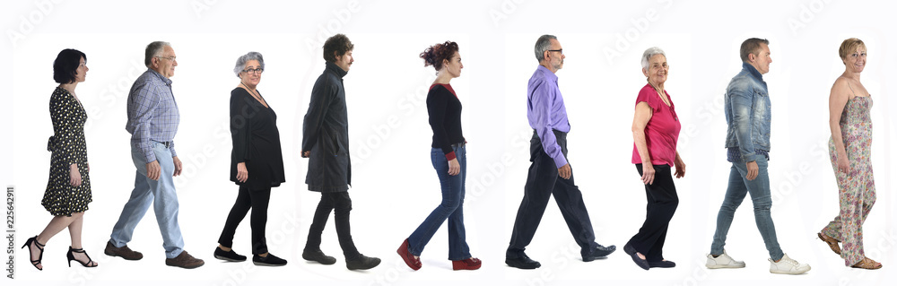group of mixed people walking on white