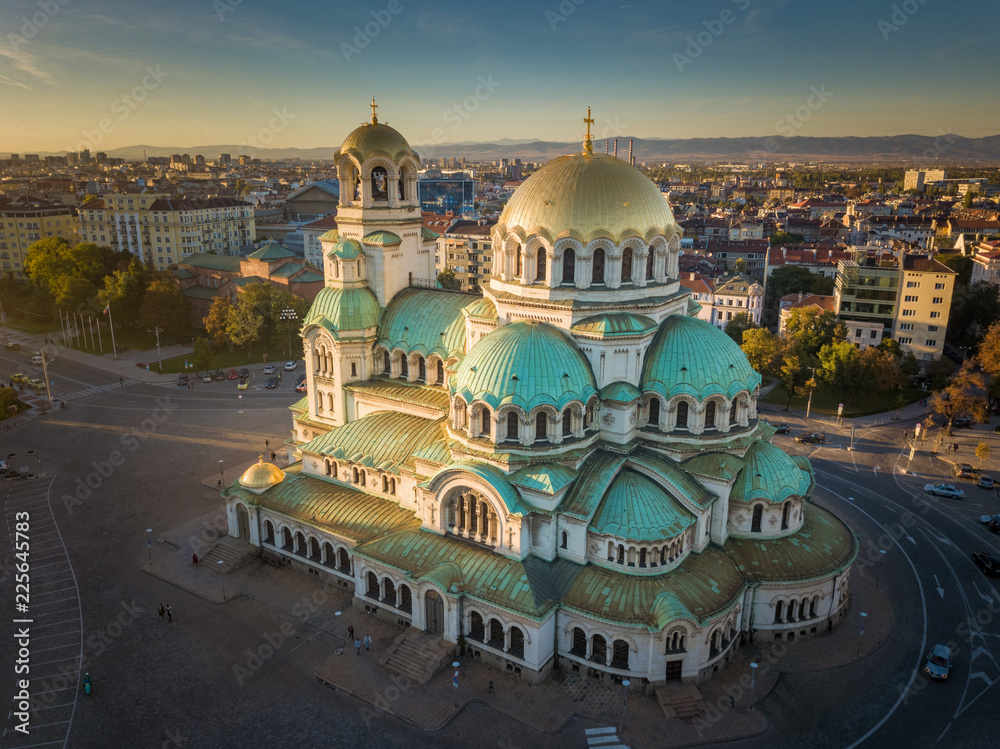 Obraz premium Alexander Nevsky cathedral in the golden light of the sunset - beautiful aerial shot of the famous landmark in Sofia, Bulgaria - a magnificent Orthodox church in the city center