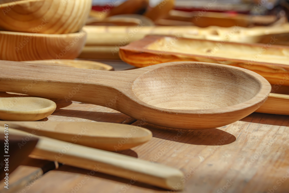 Wooden spoons handmade of different sizes, sold on the market