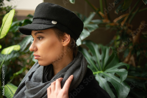 young woman in hat and scarf on the background of the jungle   © photollurg