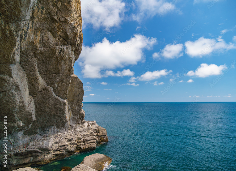 Sea aerial view, Top view, amazing nature background.The color of the water and beautifully bright. Azure beach with rocky mountains and clear water of Crimea at sunny day.