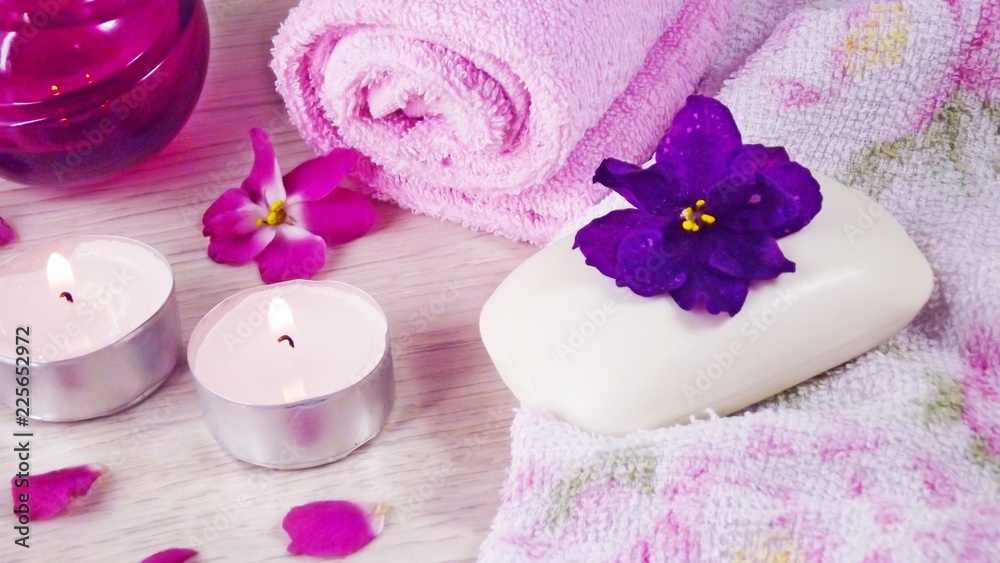 Romantic composition with candles and flowers.The concept of Spa,cosmetic,procedure,treatment. Romantic composition with candles and flowers.The concept of Spa,cosmetic,procedure,treatment.