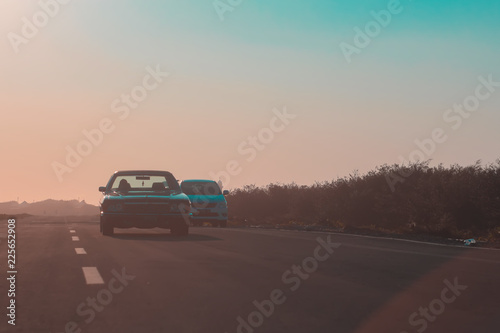 car asphalt road and sun rising at skyline © IsnainiMaruf