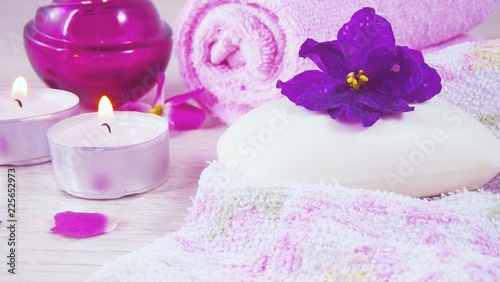 Romantic composition with candles and flowers.The concept of Spa cosmetic procedure treatment.