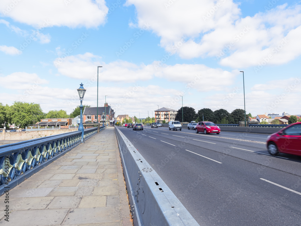 Light morning commuter traffic crossing Trent Bridge in Nottingham