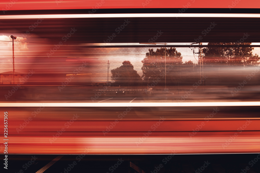 Blurry abstract detail of train driving by with showing motion. Waiting for the train to pass the street. Brunswick, Lower Saxony in Germany Blurry abstract detail of train driving by with showing motion. Waiting for the train to pass the street. Brunswick, Lower Saxony in Germany