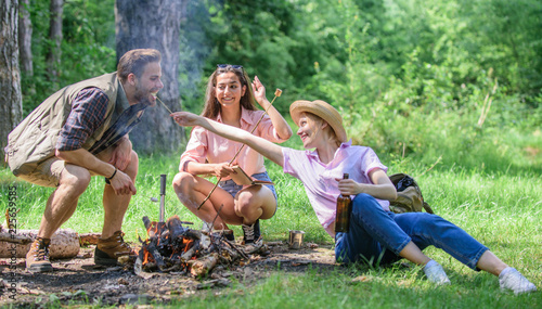 Spend great time on weekend. Take a break to have snack. Company friends eat food snack nature background. Hikers on picnic. Company hikers at picnic roasting marshmallows snacks eating food