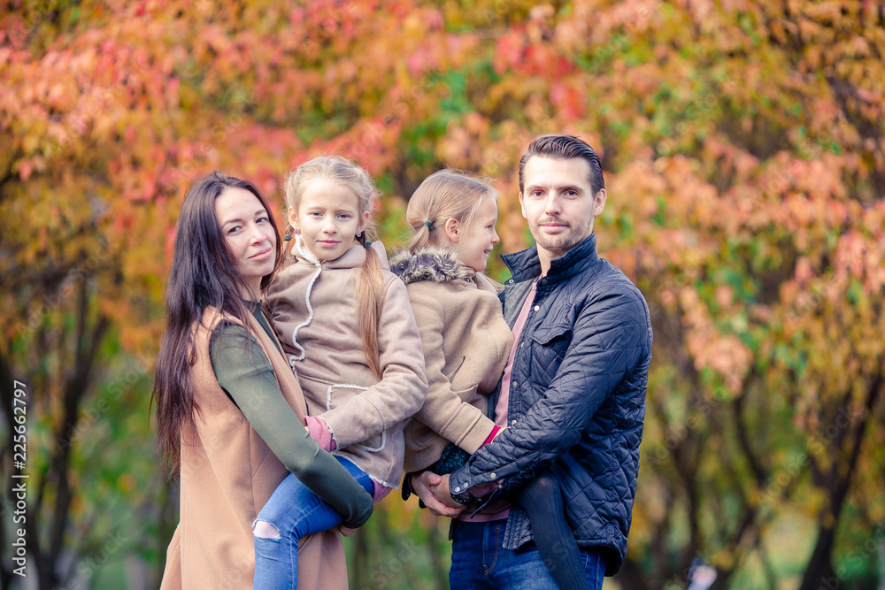 Portrait of happy family of four in autumn day Portrait of happy family of four in autumn day