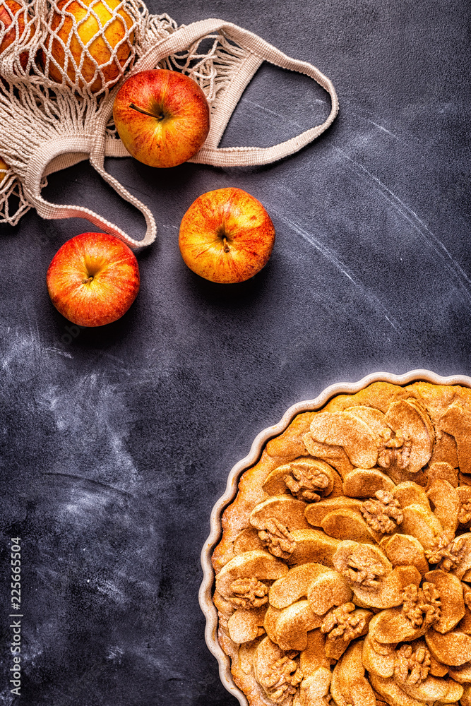 Fototapeta premium Apple pie with walnuts and cinnamon.