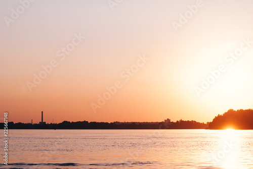 Reflection of sunset over the water  romantic landscape  crimson sunset on the river 