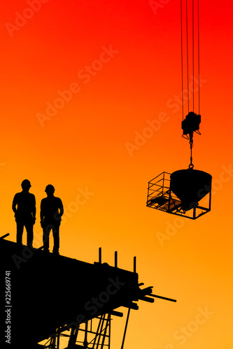 Engineers are consulting before ordering construction work on site. Construction teams are working in heavy industries, ground and safety concepts.