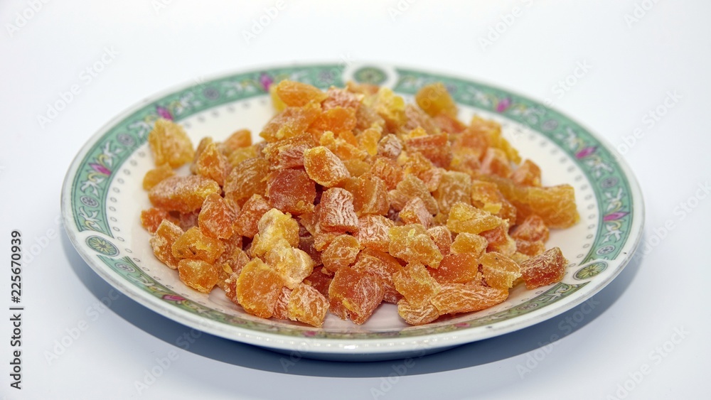chopped apricots on turkish plate on white background chopped apricots on turkish plate on white background