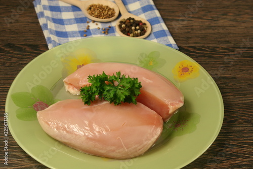 Raw chicken breast and spices close up. Selective focus