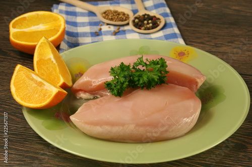 Raw chicken breast and spices close up. Selective focus