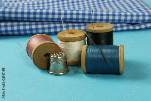 wooden spools with colored cotton threads for sewing, vintage