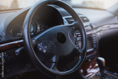 luxury car Interior - steering wheel, shift lever and dashboard.  © kucheruk