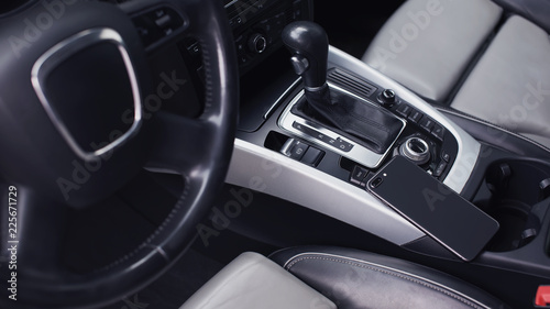 smartphone in the interior of a modern car