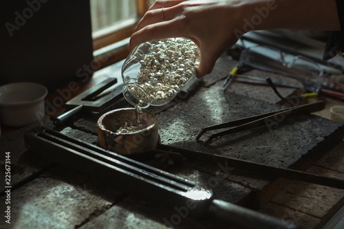 Jewelry designer working in workshop photo