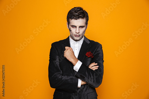Handsome man zombie looking camera seriously isolated