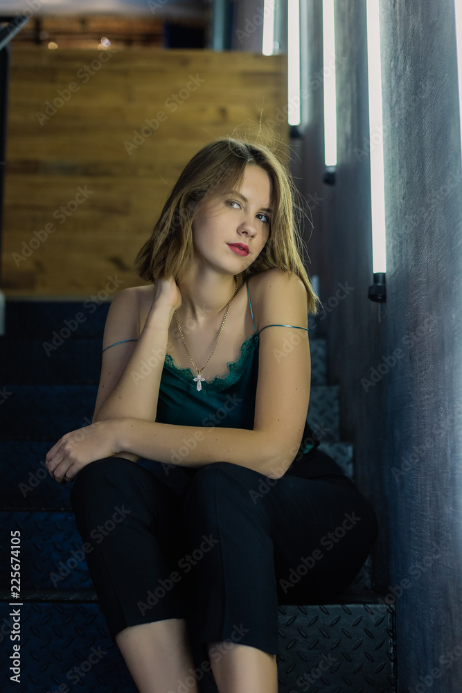 Very beautiful girl posing in a room with lamps, model business. Very beautiful girl posing in a room with lamps, model business.