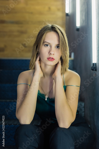 Very beautiful girl posing in a room with lamps, model business.