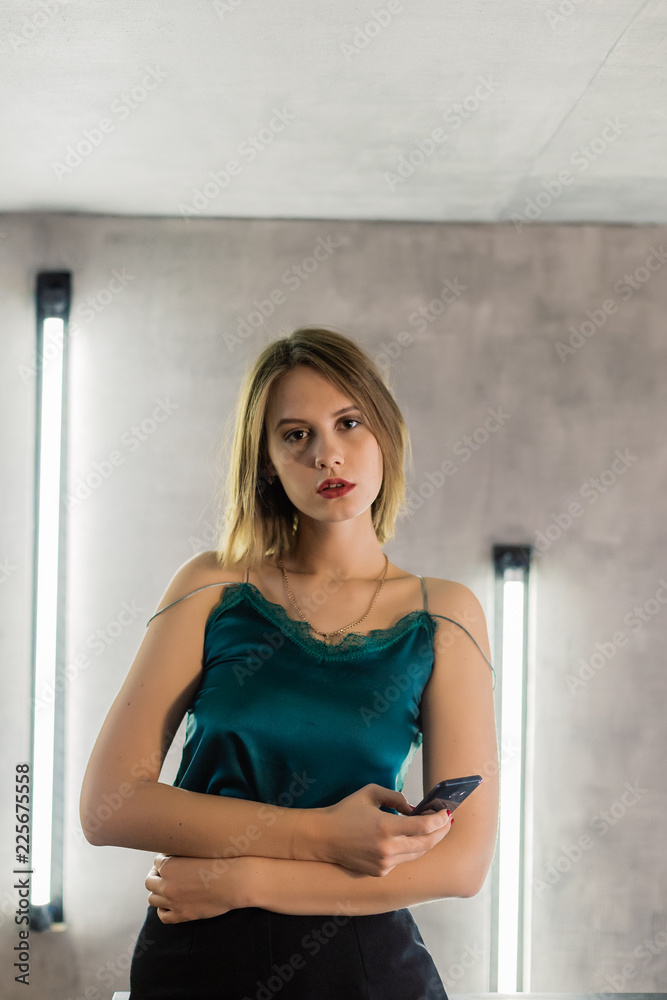 Very beautiful girl posing in a room with lamps, model business. Very beautiful girl posing in a room with lamps, model business.