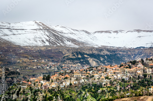 Canvas Print Amazing city in the valleys of the Lebanon, snowcape mountains, cloudy day, beua