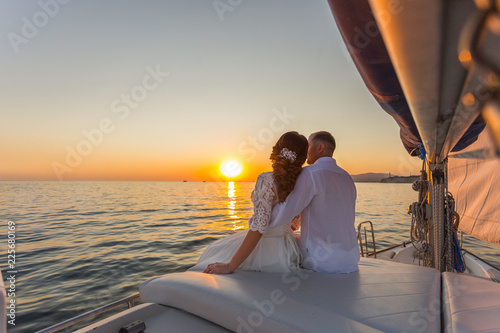 wedding couple travel on yacht at sunset © yana_vinnikova