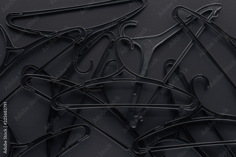 background with black hangers on black, top view for black friday background with black hangers on black, top view for black friday