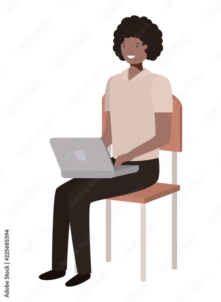 black man sitting in school chair with laptop black man sitting in school chair with laptop